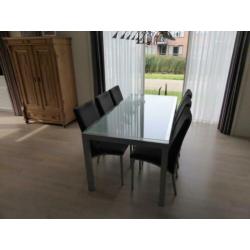 Eetkamerset glazen tafel met 6 grijze stoelen