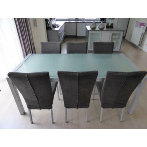 Eetkamerset glazen tafel met 6 grijze stoelen