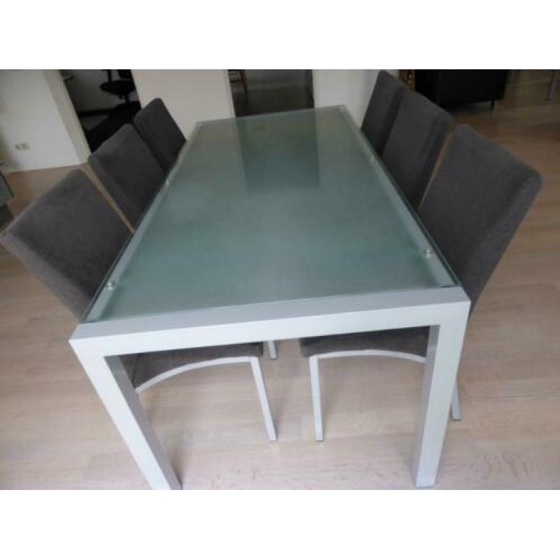 Eetkamerset glazen tafel met 6 grijze stoelen